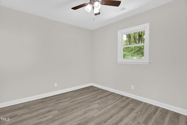 1605 Nixon St, Durham, NC 27707 - spare room featuring wood finished floors and ceiling fan