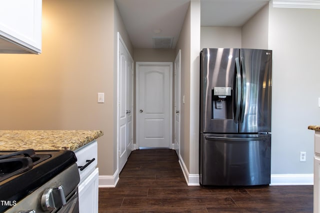 5200 Fieldwood Ct, Raleigh, NC 27616 - kitchen with stainless steel fridge with ice dispenser, white cabinets, dark wood-style floors, and light stone counters