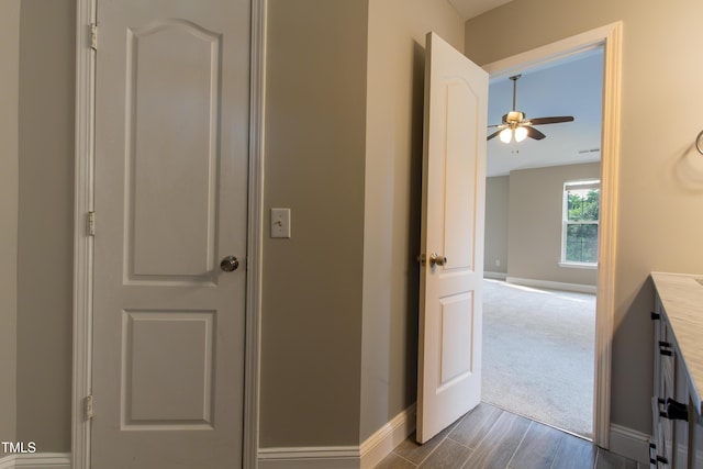 5200 Fieldwood Ct, Raleigh, NC 27616 - hallway with baseboards and dark wood finished floors