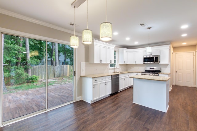 5200 Fieldwood Ct, Raleigh, NC 27616 - kitchen featuring appliances with stainless steel finishes, crown molding, light stone counters, white cabinets, and dark wood-style flooring