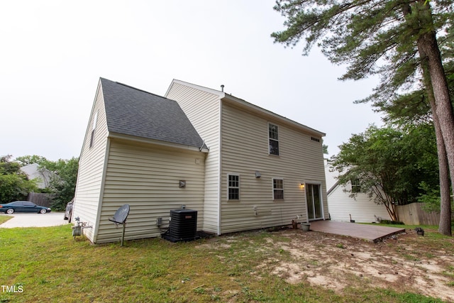 5200 Fieldwood Ct, Raleigh, NC 27616 - rear view of house with roof with shingles and a patio