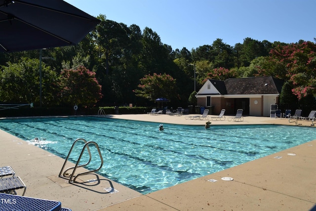 5200 Fieldwood Ct, Raleigh, NC 27616 - community pool featuring a patio area