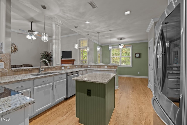8116 Mosby Way, Willow Springs, NC 27592 - kitchen featuring appliances with stainless steel finishes, ceiling fan, light wood-style flooring, recessed lighting, and decorative light fixtures