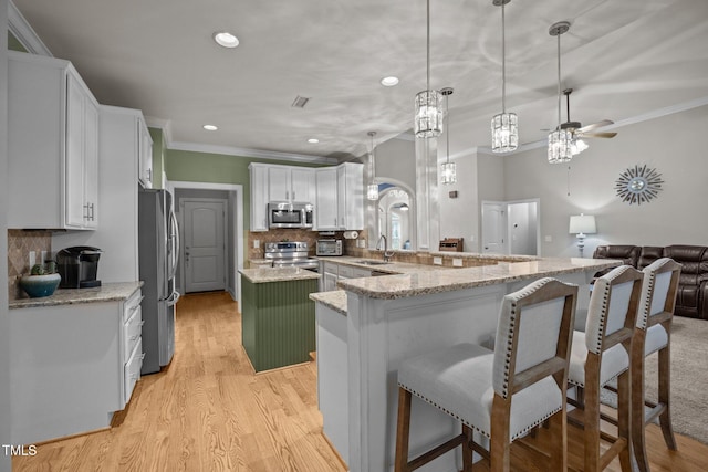 8116 Mosby Way, Willow Springs, NC 27592 - kitchen featuring stainless steel appliances, ornamental molding, recessed lighting, decorative backsplash, and a ceiling fan