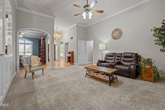 8116 Mosby Way, Willow Springs, NC 27592 - carpeted living area with arched walkways, a ceiling fan, crown molding, and a chandelier