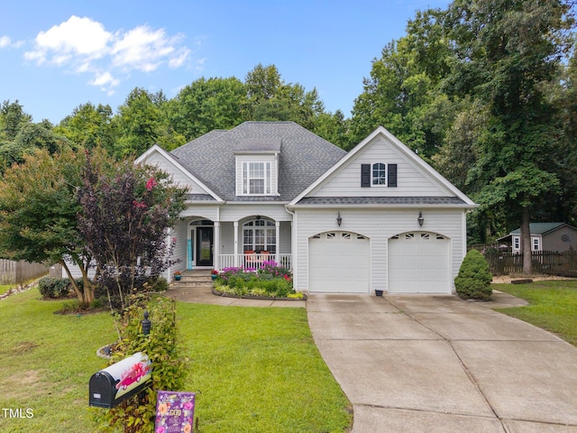 8116 Mosby Way, Willow Springs, NC 27592 - traditional-style house featuring covered porch, driveway, an attached garage, and a shingled roof