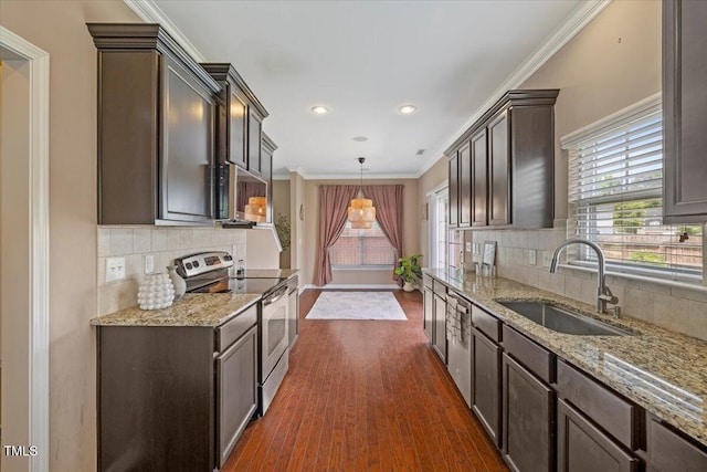 504 Gumview Cir, Fuquay Varina, NC 27526 - kitchen with stainless steel appliances, healthy amount of natural light, dark wood finished floors, light stone counters, and ornamental molding
