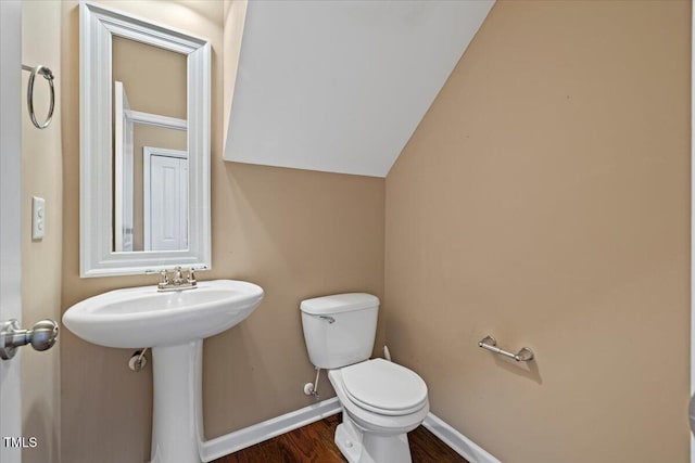 504 Gumview Cir, Fuquay Varina, NC 27526 - half bathroom featuring wood finished floors and lofted ceiling