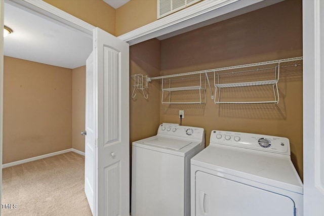 504 Gumview Cir, Fuquay Varina, NC 27526 - washroom featuring washing machine and clothes dryer and light colored carpet