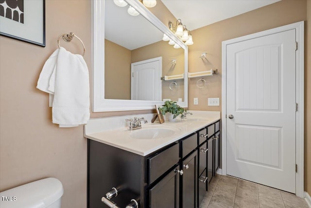 504 Gumview Cir, Fuquay Varina, NC 27526 - bathroom with double vanity and tile patterned floors