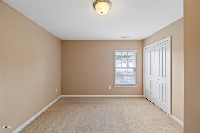 504 Gumview Cir, Fuquay Varina, NC 27526 - unfurnished bedroom featuring light carpet and a closet