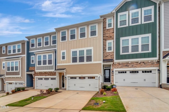 2735 Hunter Woods Dr # 571, Apex, NC 27502 - view of property featuring stone siding, board and batten siding, concrete driveway, and an attached garage
