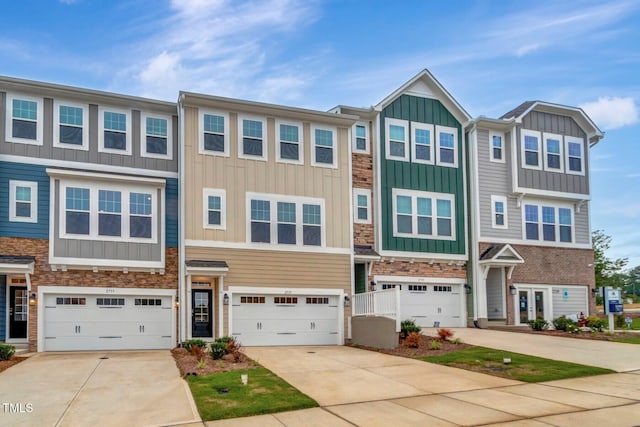2735 Hunter Woods Dr # 571, Apex, NC 27502 - multi unit property featuring board and batten siding, concrete driveway, an attached garage, and stone siding