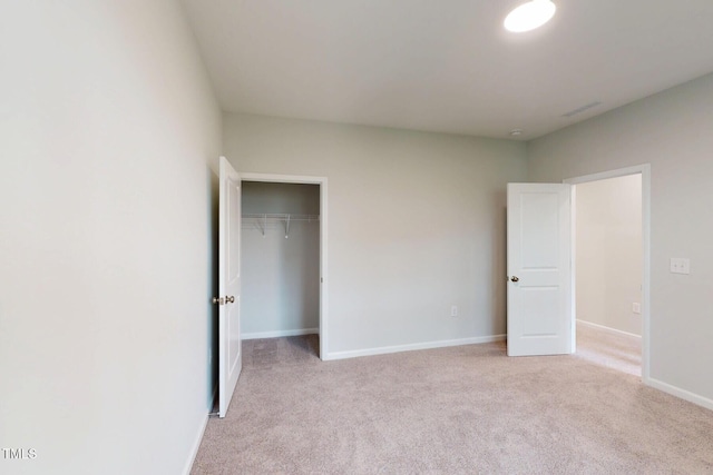 2735 Hunter Woods Dr # 571, Apex, NC 27502 - unfurnished bedroom featuring light carpet and a closet