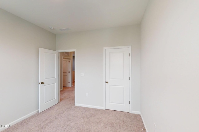 2735 Hunter Woods Dr # 571, Apex, NC 27502 - unfurnished bedroom featuring carpet flooring and baseboards