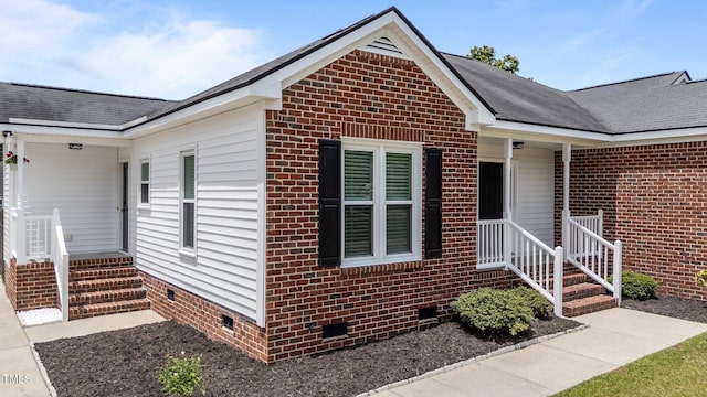 4408 Highmeadow Ln N, Wilson, NC 27896 - view of front facade with crawl space, brick siding, and roof with shingles
