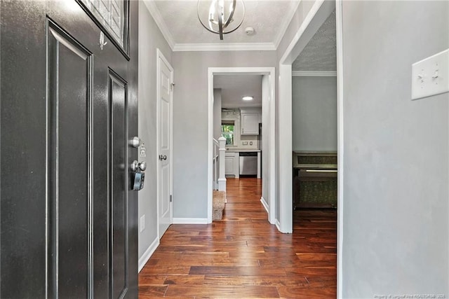 6405 Riegelwood St, Fayetteville, NC 28314 - entryway with wood finished floors, a chandelier, and ornamental molding