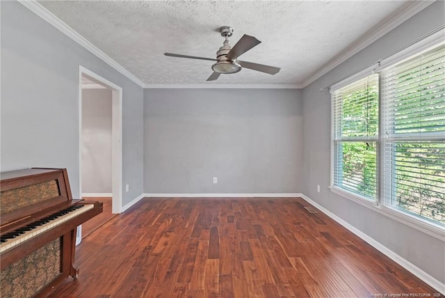 6405 Riegelwood St, Fayetteville, NC 28314 - spare room featuring healthy amount of natural light, dark wood-style flooring, ceiling fan, a textured ceiling, and crown molding