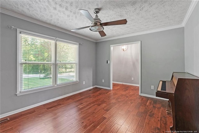 6405 Riegelwood St, Fayetteville, NC 28314 - empty room featuring wood finished floors, a ceiling fan, a textured ceiling, and crown molding