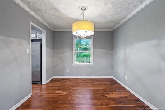 6405 Riegelwood St, Fayetteville, NC 28314 - unfurnished dining area with wood finished floors, a textured ceiling, and ornamental molding