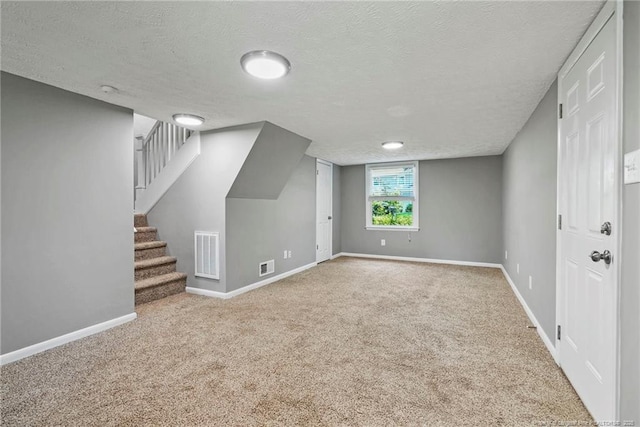 6405 Riegelwood St, Fayetteville, NC 28314 - additional living space with carpet floors, a textured ceiling, and stairs