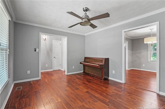 6405 Riegelwood St, Fayetteville, NC 28314 - unfurnished living room with ceiling fan, wood finished floors, a textured ceiling, and crown molding