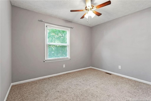 6405 Riegelwood St, Fayetteville, NC 28314 - carpeted empty room featuring a textured ceiling and ceiling fan
