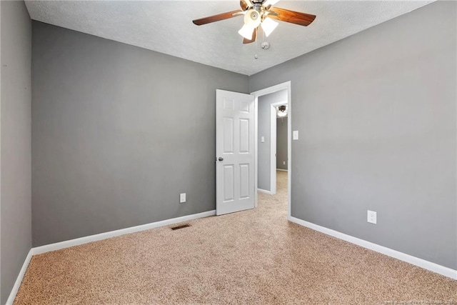 6405 Riegelwood St, Fayetteville, NC 28314 - unfurnished room with carpet, a ceiling fan, and a textured ceiling