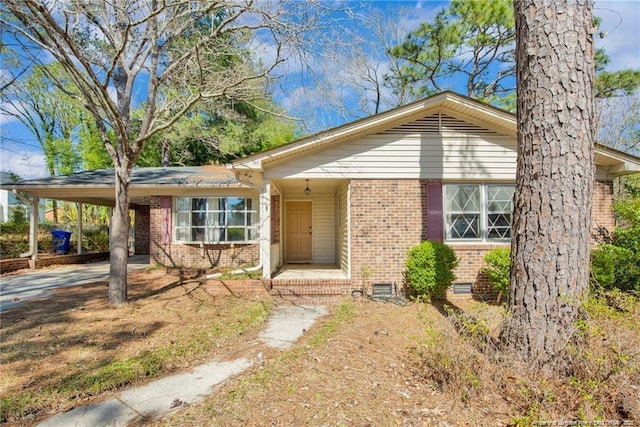6411 Huntleigh Ct, Fayetteville, NC 28303 - ranch-style home featuring brick siding, crawl space, an attached carport, and concrete driveway