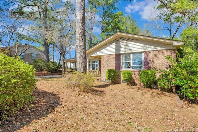 6411 Huntleigh Ct, Fayetteville, NC 28303 - view of property exterior featuring brick siding