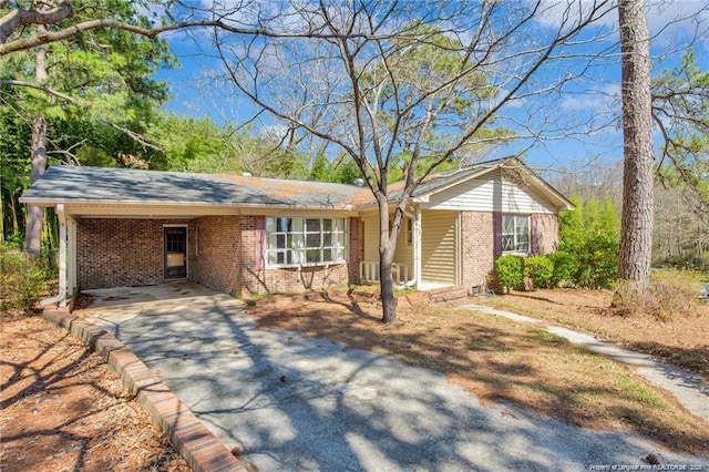 6411 Huntleigh Ct, Fayetteville, NC 28303 - ranch-style house with brick siding, asphalt driveway, and a carport