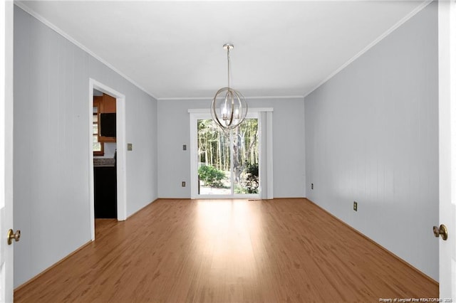 6411 Huntleigh Ct, Fayetteville, NC 28303 - unfurnished dining area with a chandelier, wood finished floors, and ornamental molding