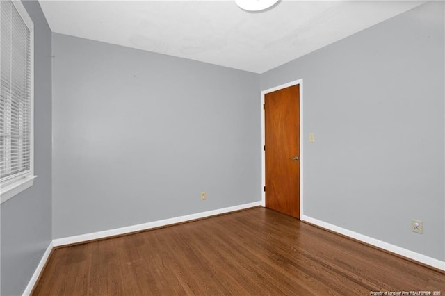 6411 Huntleigh Ct, Fayetteville, NC 28303 - unfurnished room featuring baseboards and wood finished floors