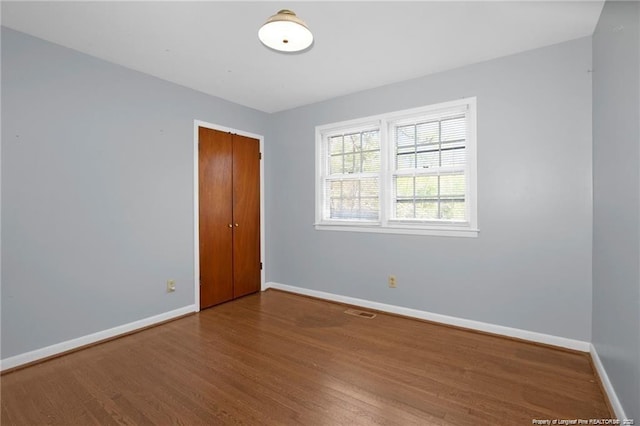 6411 Huntleigh Ct, Fayetteville, NC 28303 - unfurnished room featuring wood finished floors and baseboards