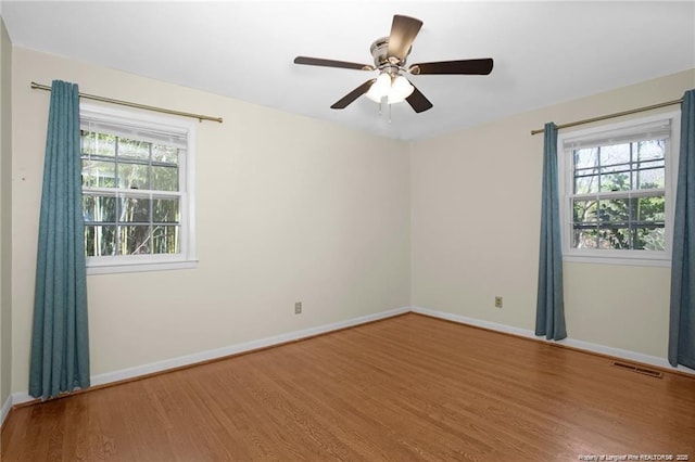6411 Huntleigh Ct, Fayetteville, NC 28303 - empty room featuring wood finished floors and ceiling fan