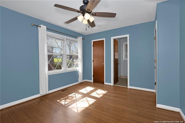 6411 Huntleigh Ct, Fayetteville, NC 28303 - unfurnished bedroom featuring wood finished floors and ceiling fan