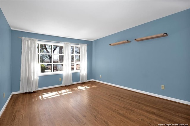 6411 Huntleigh Ct, Fayetteville, NC 28303 - empty room with baseboards and wood finished floors