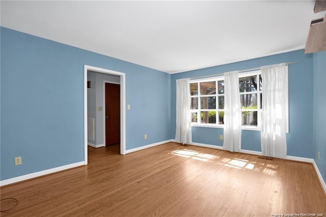 6411 Huntleigh Ct, Fayetteville, NC 28303 - empty room with wood finished floors and baseboards