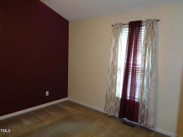 221 Hickory Glen Ln, Durham, NC 27703 - empty room featuring carpet and vaulted ceiling