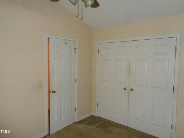 221 Hickory Glen Ln, Durham, NC 27703 - unfurnished bedroom with carpet, a closet, vaulted ceiling, and a ceiling fan