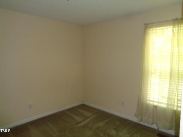 221 Hickory Glen Ln, Durham, NC 27703 - spare room featuring baseboards and carpet floors