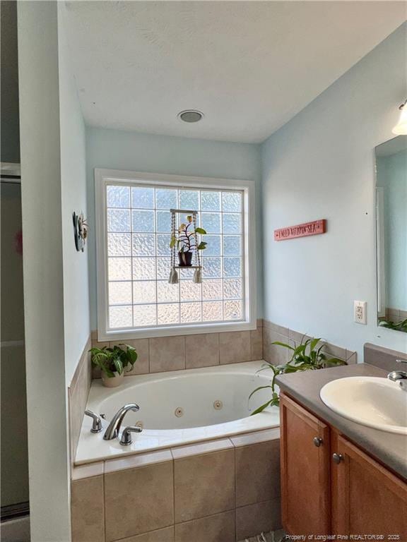 3401 Connection Dr, Fayetteville, NC 28311 - bathroom with vanity and a tub with jets