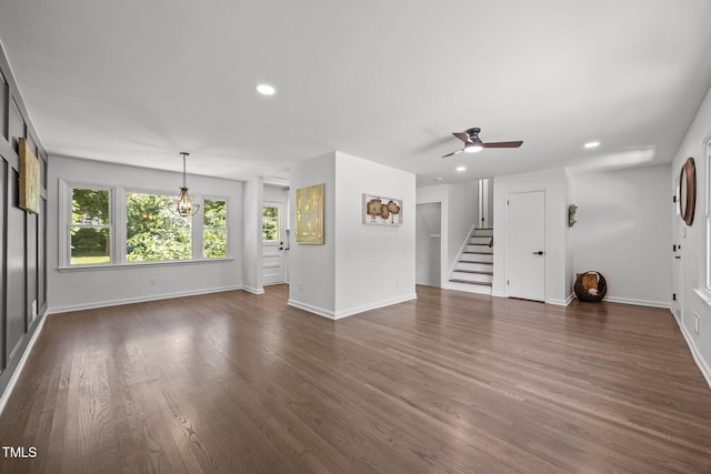 2317 Bertie Dr, Raleigh, NC 27610 - unfurnished living room featuring a ceiling fan, dark wood-style flooring, recessed lighting, and stairway
