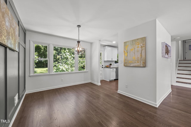 2317 Bertie Dr, Raleigh, NC 27610 - unfurnished dining area with a chandelier, dark wood-style floors, and stairway