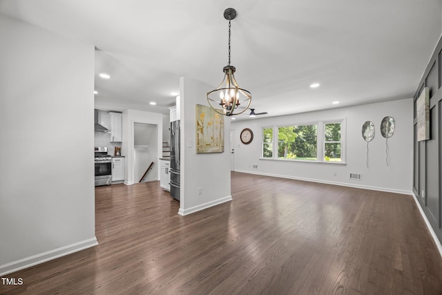 2317 Bertie Dr, Raleigh, NC 27610 - unfurnished living room with a chandelier, dark wood-type flooring, recessed lighting, and stairway