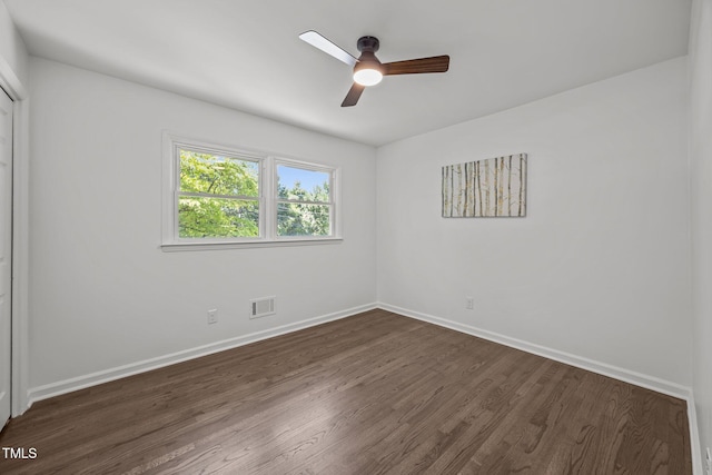 2317 Bertie Dr, Raleigh, NC 27610 - spare room with dark wood-type flooring and a ceiling fan