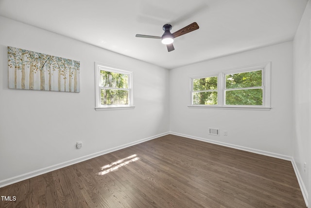2317 Bertie Dr, Raleigh, NC 27610 - unfurnished room with plenty of natural light, dark wood-style floors, and ceiling fan