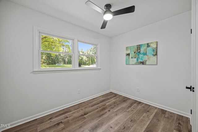 2317 Bertie Dr, Raleigh, NC 27610 - empty room with wood finished floors and a ceiling fan
