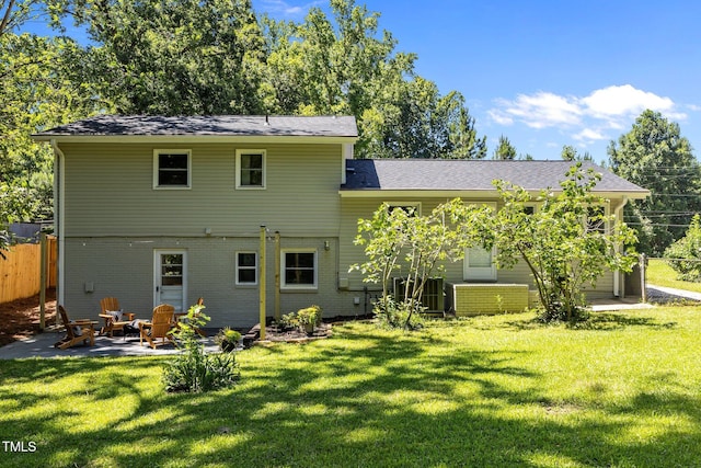 2317 Bertie Dr, Raleigh, NC 27610 - back of house featuring a patio and brick siding