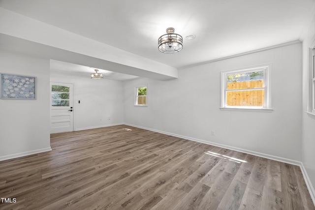 2317 Bertie Dr, Raleigh, NC 27610 - empty room with wood finished floors and a chandelier